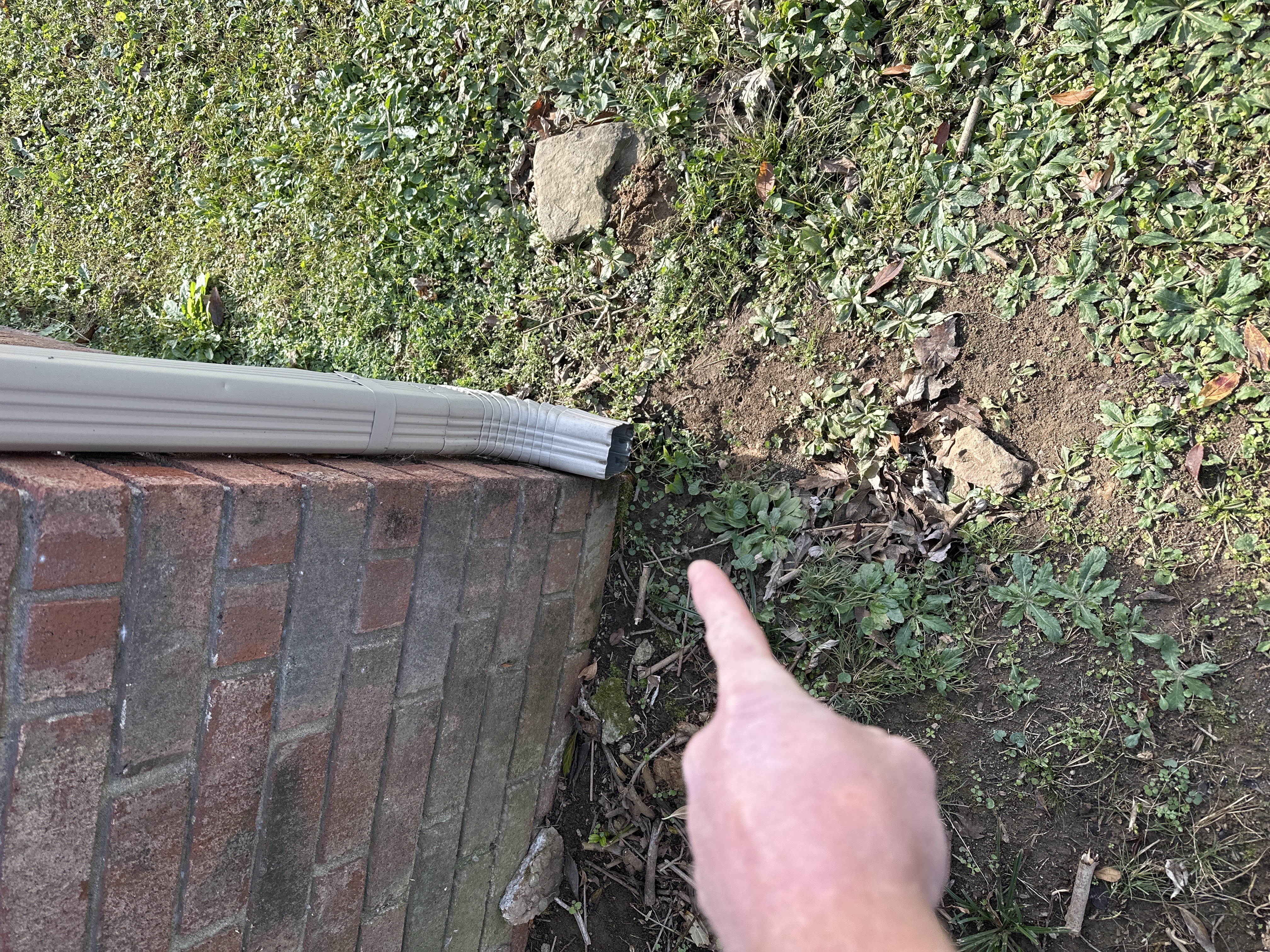 Joseph Gossett inspecting chimney and roof conditions